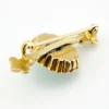 Late Victorian 14k gold brooch with oval turquoise, natural seed-pearl halo, and fleur-de-lis ends