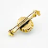 Late Victorian 14k gold brooch with oval turquoise, natural seed-pearl halo, and fleur-de-lis ends