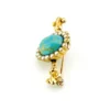 Late Victorian 14k gold brooch with oval turquoise, natural seed-pearl halo, and fleur-de-lis ends