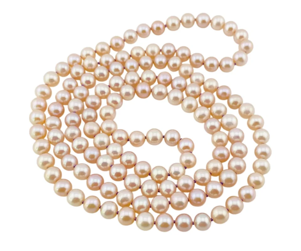 Vintage cream cultured pearl necklace with 5.5mm hand-knotted pearls in a 29-inch endless strand