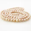 Vintage cream cultured pearl necklace with 5.5mm hand-knotted pearls in a 29-inch endless strand
