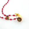 Ruby bead conversion necklace with Victorian mother-of-pearl cornucopia, garnet and antique paste ornament