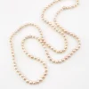 Vintage cream cultured pearl necklace with 5.5mm hand-knotted pearls in a 29-inch endless strand