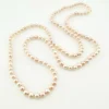 Vintage cream cultured pearl necklace with 5.5mm hand-knotted pearls in a 29-inch endless strand