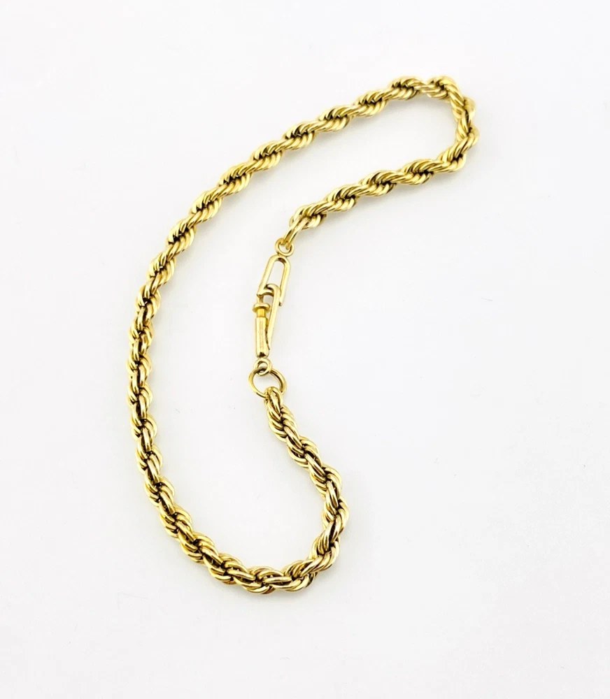 Close-up of the tube clasp and twisted rope links on a vintage gold-filled bracelet