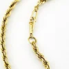 Close-up of the tube clasp and twisted rope links on a vintage gold-filled bracelet