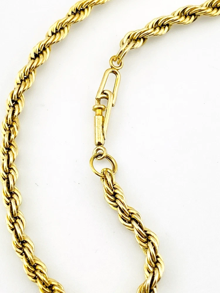Close-up of the tube clasp and twisted rope links on a vintage gold-filled bracelet