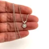 Vintage 14k white gold necklace with a .10-carat diamond in a round illusion setting on a delicate rope chain