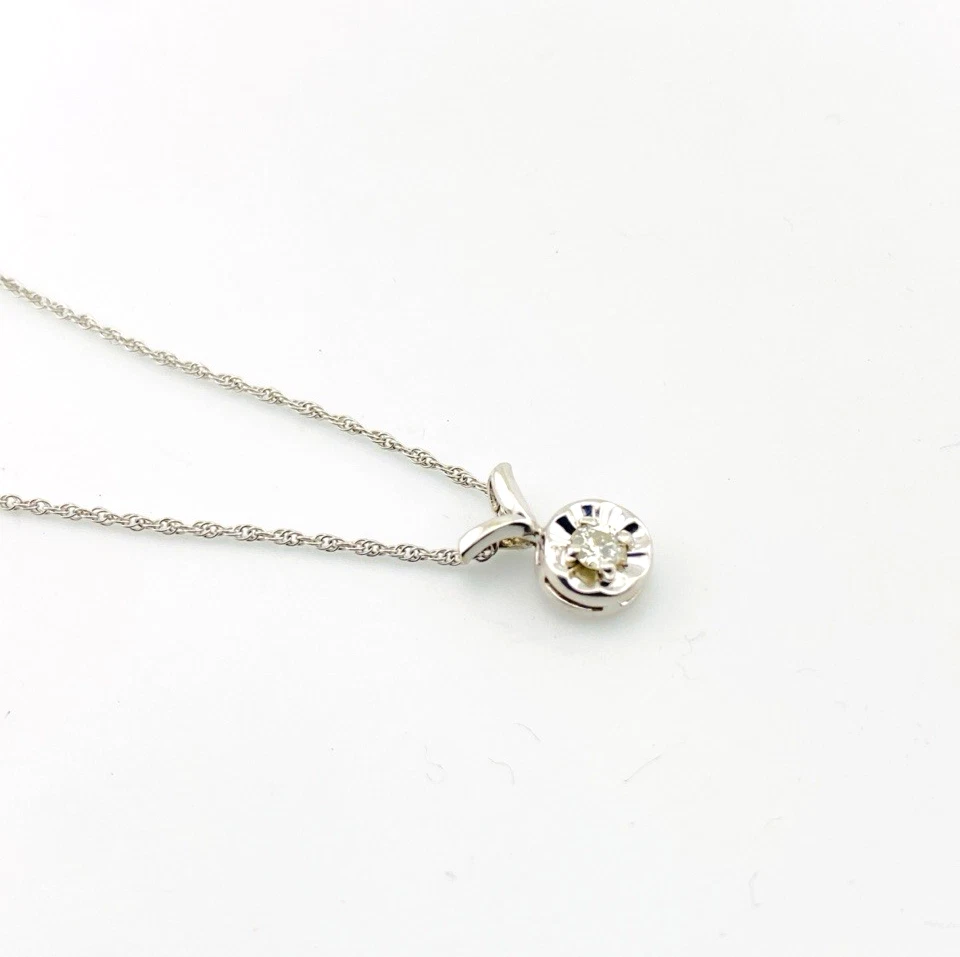 Vintage 14k white gold necklace with a .10-carat diamond in a round illusion setting on a delicate rope chain