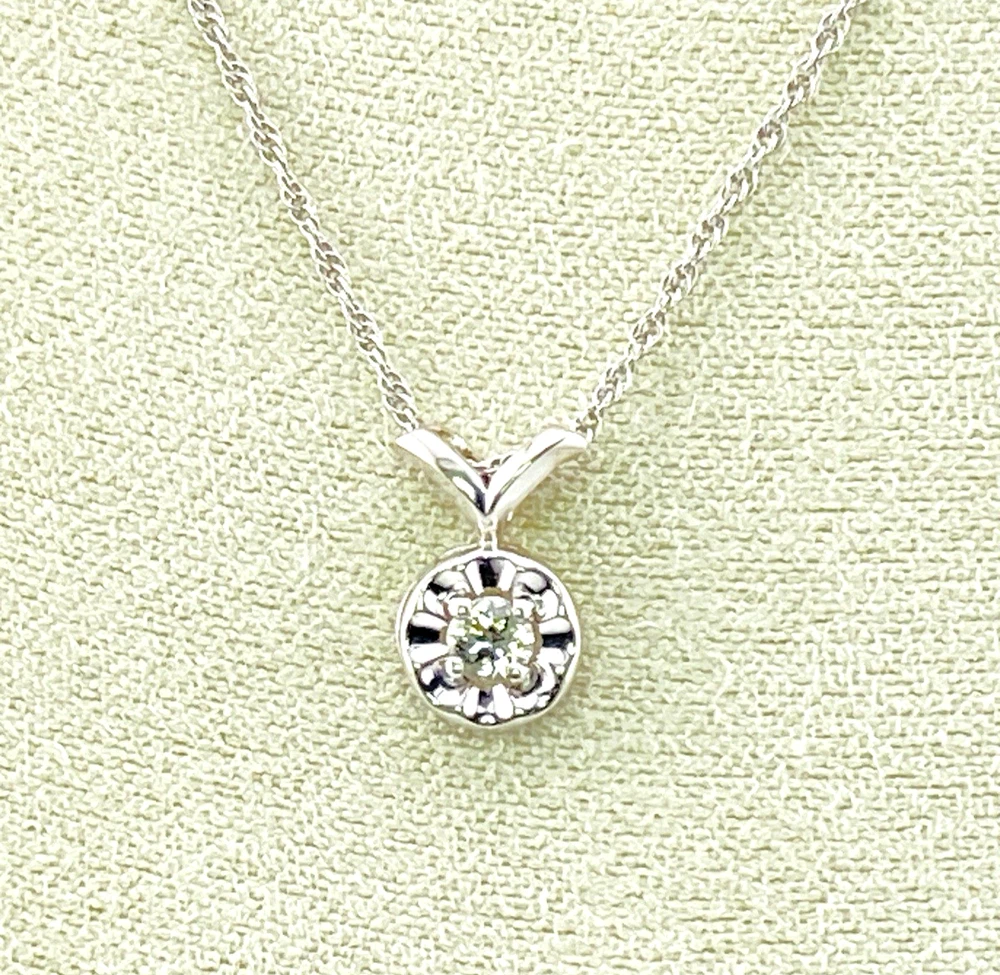 Vintage 14k white gold necklace with a .10-carat diamond in a round illusion setting on a delicate rope chain