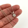 Vintage 14k white gold necklace with a .10-carat diamond in a round illusion setting on a delicate rope chain