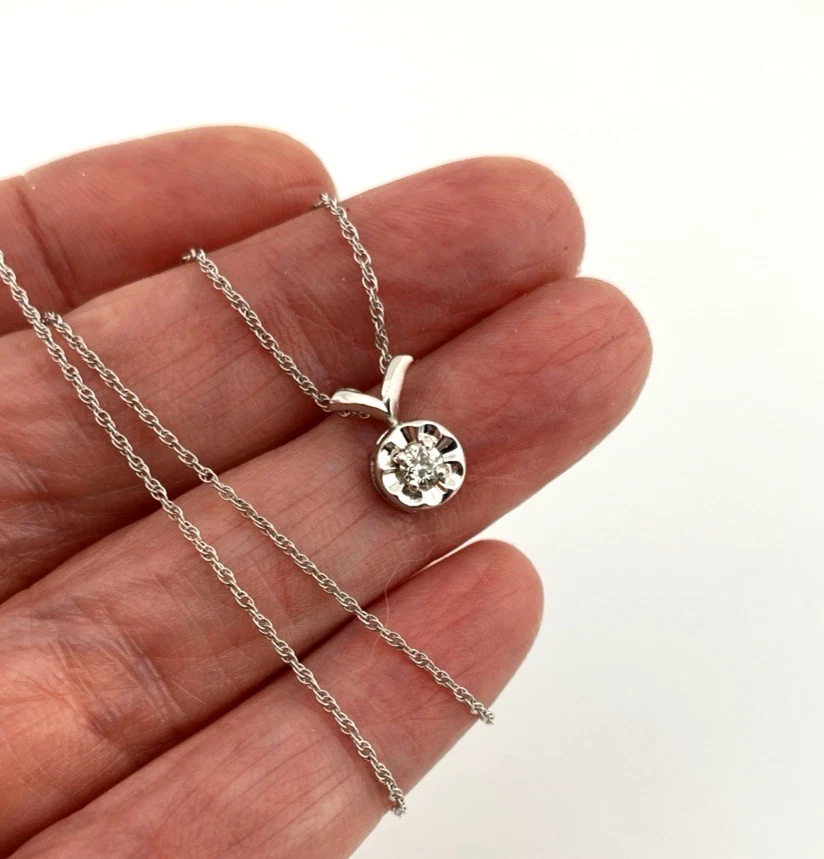 Vintage 14k white gold necklace with a .10-carat diamond in a round illusion setting on a delicate rope chain