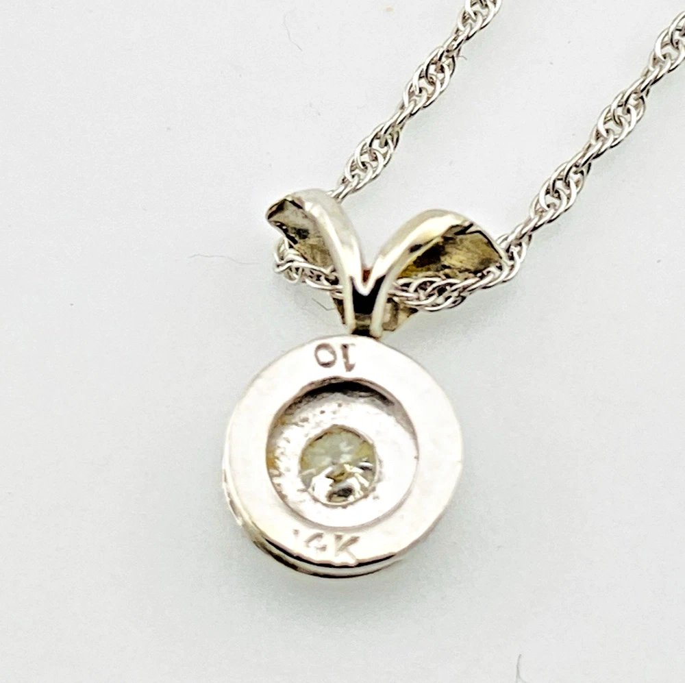 Reverse of the 14k white gold diamond pendant showing the 10 and 14K marks