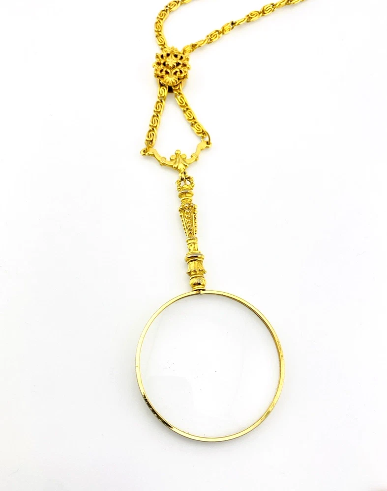 Vintage gold-plated magnifying loupe necklace with an adjustable slide and 30-inch scroll-link chain