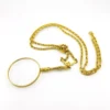 Vintage gold-plated magnifying loupe necklace with an adjustable slide and 30-inch scroll-link chain