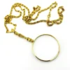 Vintage gold-plated magnifying loupe necklace with an adjustable slide and 30-inch scroll-link chain