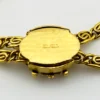 Vintage gold-plated magnifying loupe necklace with an adjustable slide and 30-inch scroll-link chain