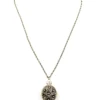 WWII-era sterling silver forget-me-not locket opened to reveal four original family photographs