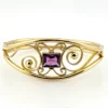 Circa 1950s gold-filled openwork clamper bracelet with rectangular amethyst glass stone and scroll decoration