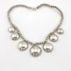 Vintage Navajo-attributed sterling silver necklace with handmade beads and seven graduated half-dome drops