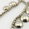 Vintage Navajo-attributed sterling silver necklace with handmade beads and seven graduated half-dome drops