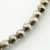 Vintage Navajo-attributed sterling silver necklace with handmade beads and seven graduated half-dome drops