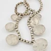 Vintage Navajo-attributed sterling silver necklace with handmade beads and seven graduated half-dome drops