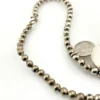 Vintage Navajo-attributed sterling silver necklace with handmade beads and seven graduated half-dome drops