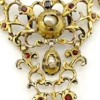 Late-18th-century Georgian gilt-brass necklace centerpiece with natural baroque pearls, red garnet-colored paste glass and pierced Rococo scrollwork