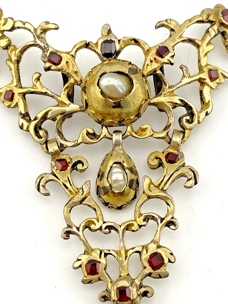 Late-18th-century Georgian gilt-brass necklace centerpiece with natural baroque pearls, red garnet-colored paste glass and pierced Rococo scrollwork