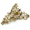 Late-18th-century Georgian gilt-brass necklace centerpiece with natural baroque pearls, red garnet-colored paste glass and pierced Rococo scrollwork