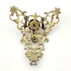 Late-18th-century Georgian gilt-brass necklace centerpiece with natural baroque pearls, red garnet-colored paste glass and pierced Rococo scrollwork