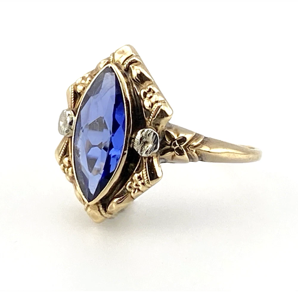 Vintage 1940s 10K gold ring with marquise blue sapphire and white gold illusion accents