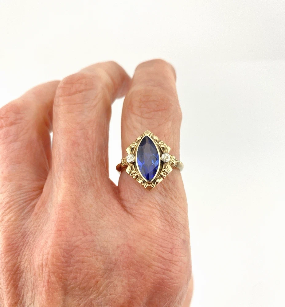 Vintage 1940s 10K gold ring with marquise blue sapphire and white gold illusion accents