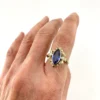 Vintage 1940s 10K gold ring with marquise blue sapphire and white gold illusion accents