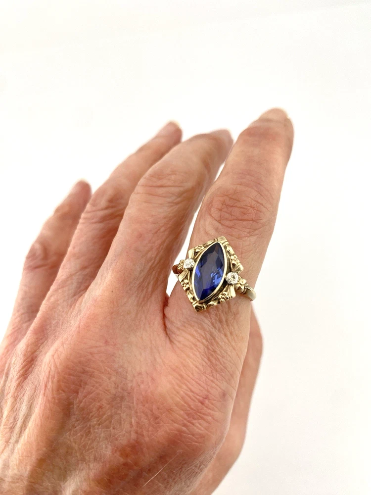 Vintage 1940s 10K gold ring with marquise blue sapphire and white gold illusion accents