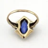 Vintage 1940s 10K gold ring with marquise blue sapphire and white gold illusion accents