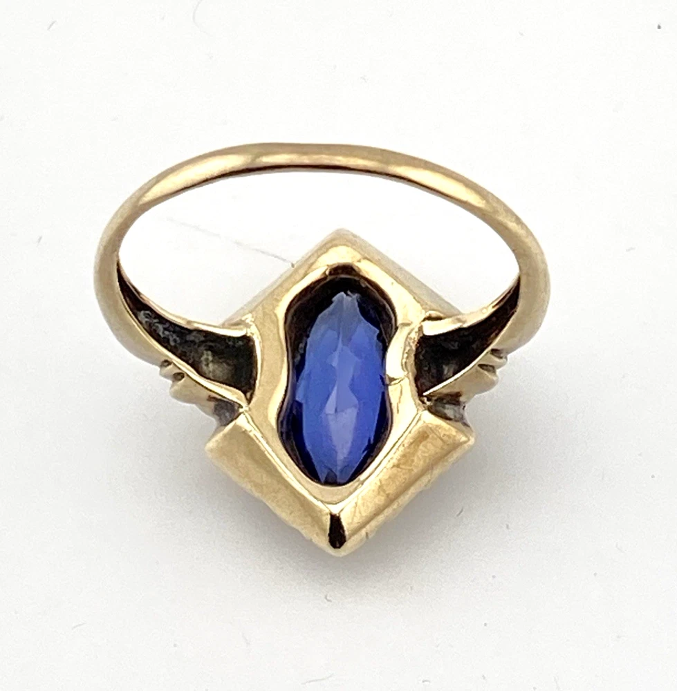 Vintage 1940s 10K gold ring with marquise blue sapphire and white gold illusion accents