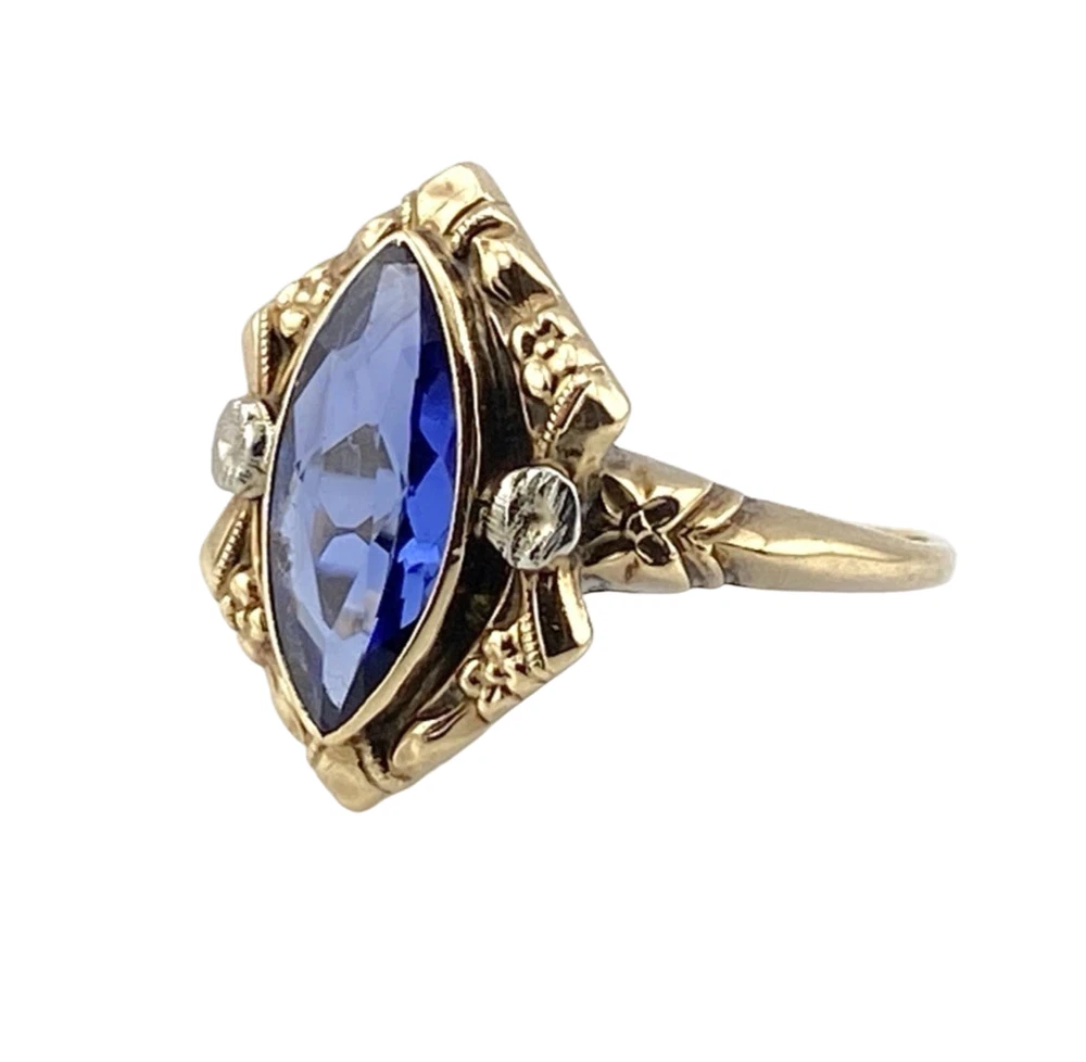 Vintage 1940s 10K gold ring with marquise blue sapphire and white gold illusion accents