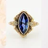 Vintage 1940s 10K gold ring with marquise blue sapphire and white gold illusion accents