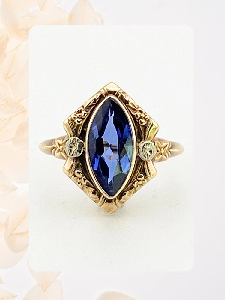 Vintage 1940s 10K gold ring with marquise blue sapphire and white gold illusion accents