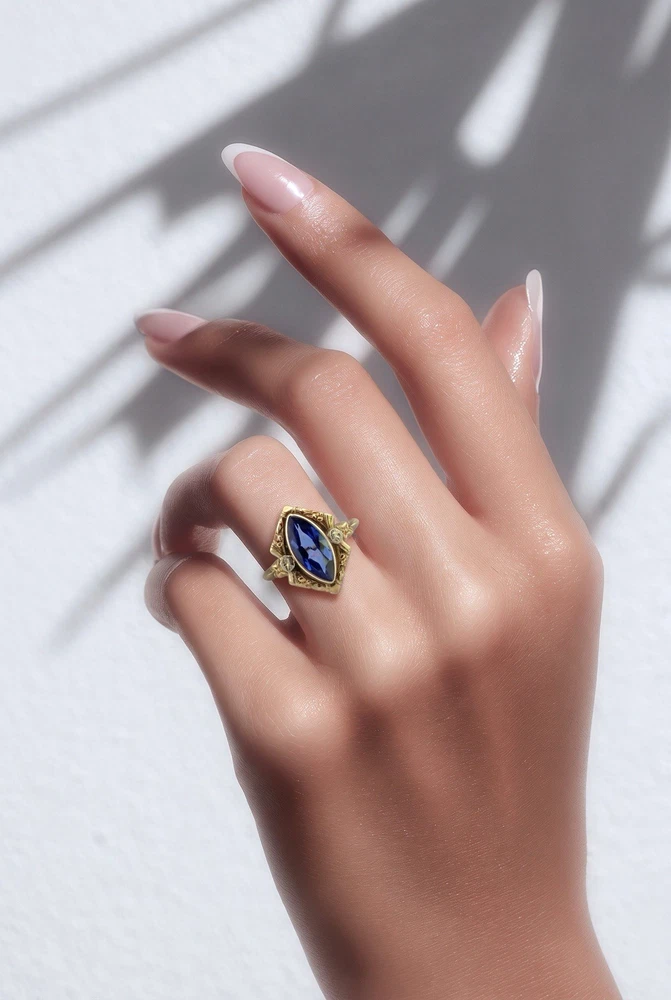Vintage 1940s 10K gold ring with marquise blue sapphire and white gold illusion accents