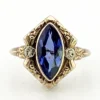 Vintage 1940s 10K gold ring with marquise blue sapphire and white gold illusion accents