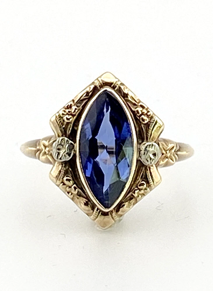 Vintage 1940s 10K gold ring with marquise blue sapphire and white gold illusion accents