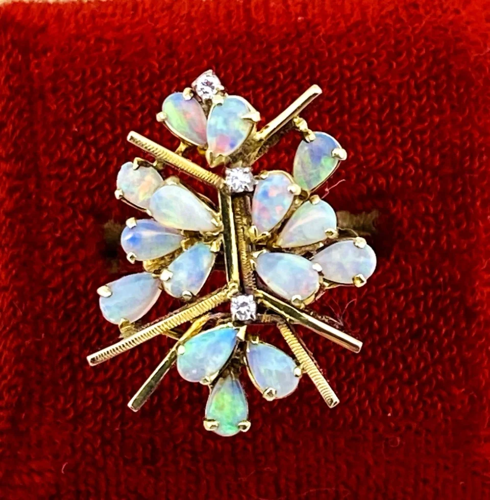 Circa 1960s hand-fabricated 14k gold Atomic starburst ring with natural pear-shaped opals and diamond accents