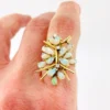 Circa 1960s hand-fabricated 14k gold Atomic starburst ring with natural pear-shaped opals and diamond accents