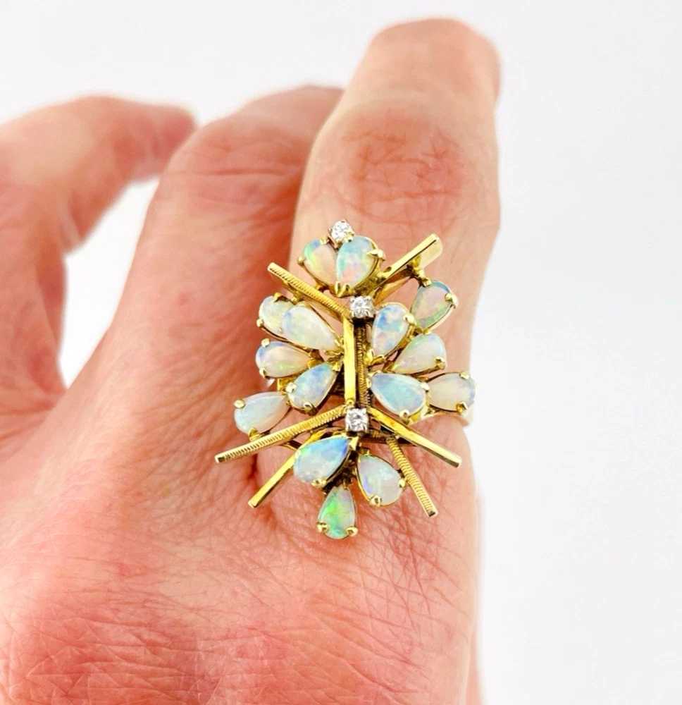 Circa 1960s hand-fabricated 14k gold Atomic starburst ring with natural pear-shaped opals and diamond accents