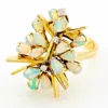 Circa 1960s hand-fabricated 14k gold Atomic starburst ring with natural pear-shaped opals and diamond accents