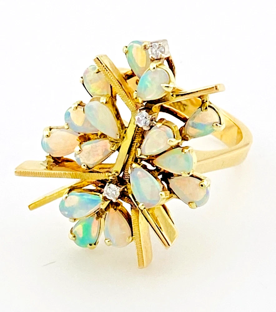 Circa 1960s hand-fabricated 14k gold Atomic starburst ring with natural pear-shaped opals and diamond accents