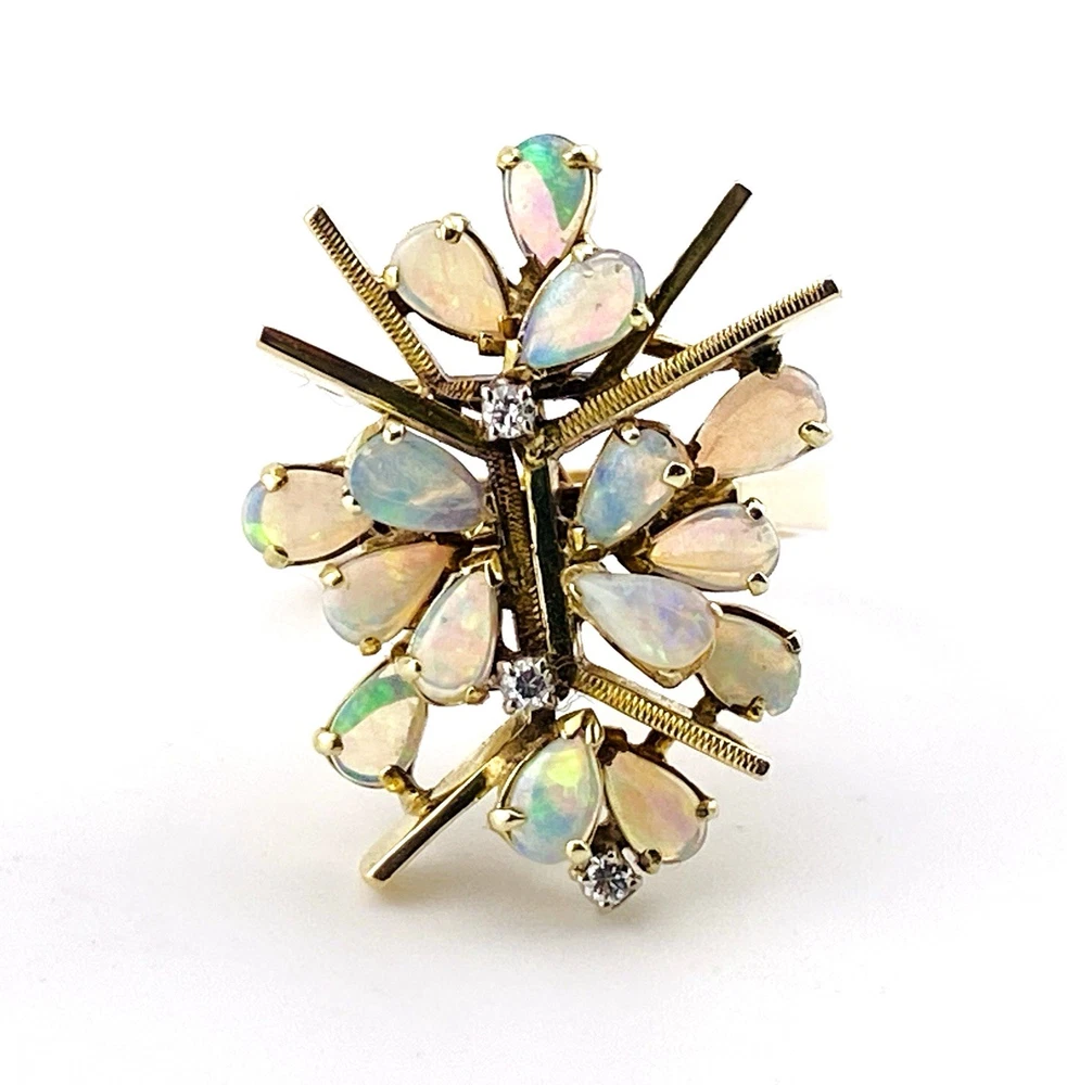 Circa 1960s hand-fabricated 14k gold Atomic starburst ring with natural pear-shaped opals and diamond accents